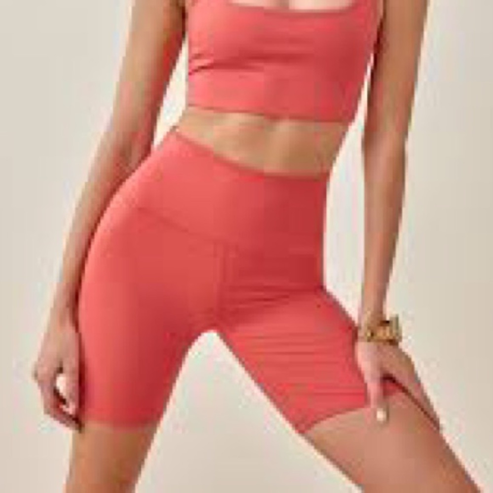 Reformation Ecomove high rise 7” bike short in hot coral